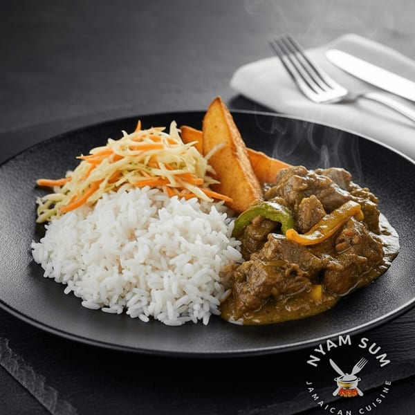 Steaming Jamaican curry goat with rice, coleslaw, and potato wedges on a black plate.