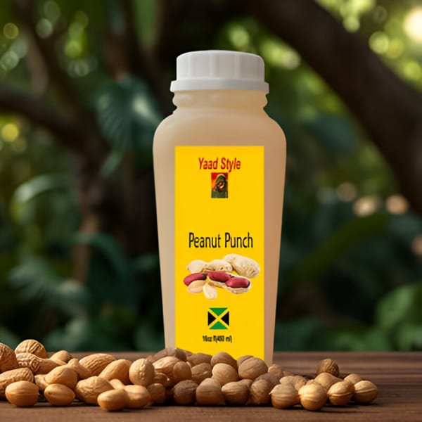 A bottle of Nyam Sum Jamaican Cuisine's Yaard Style Peanut Punch, surrounded by peanuts on a wooden surface.