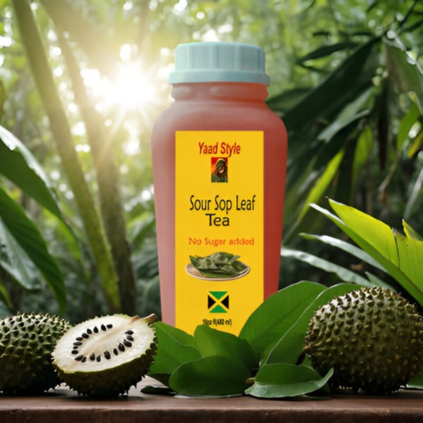 Yaad Style Sour Sop Leaf Tea bottle with soursop fruit and leaves on a wooden surface.