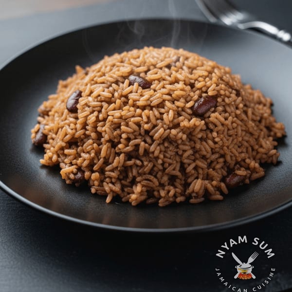 Steaming Jamaican rice and peas, a Nyam Sum specialty, served on a black plate.